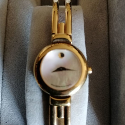 Movado women's watch like new with bracelet and sapphire crystal