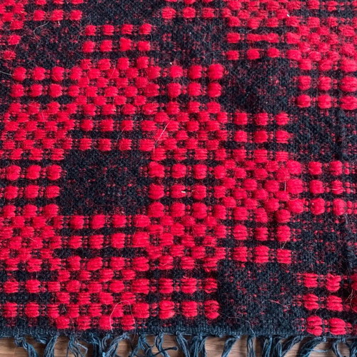 Machine-made wool rugs new with fringes and geometric patterns