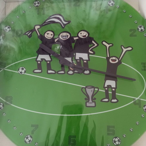Wall clock with football theme, quartz mechanism, glass/plastic surface