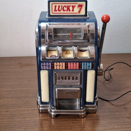 Marksman Las Vegas Lucky 7 AM/FM radio used, one armed bandit slot machine