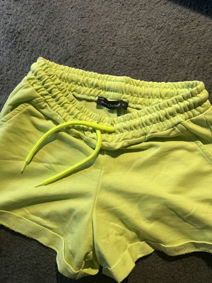 Yellow-green shorts with fluorescent drawstrings