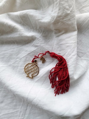 Handmade lucky charm with metal elements and tassel made to order