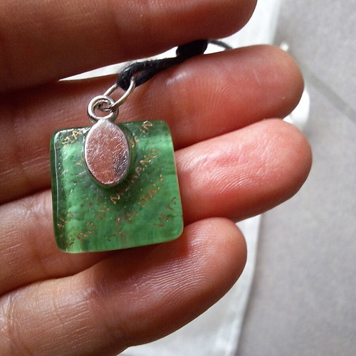 Necklace pendant with green floral design