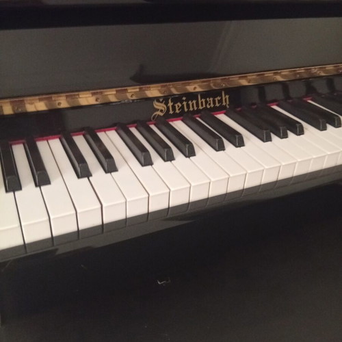 Piano used, black wall Steinbach