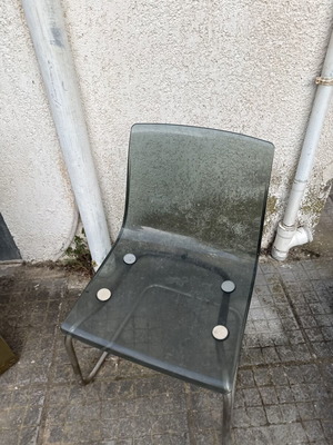 Transparent chair with tinted seat and chrome metal frame