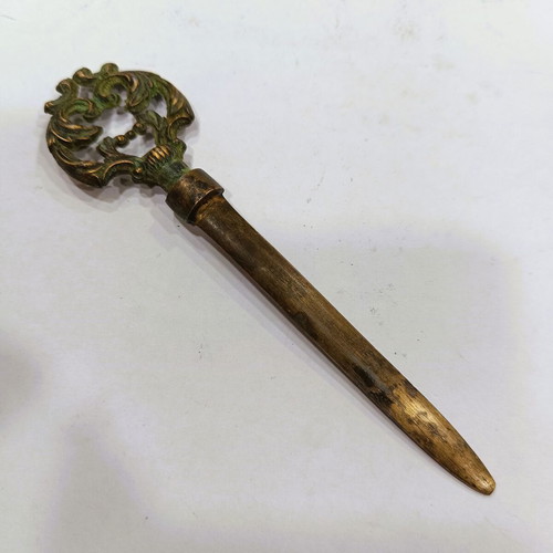 Vintage brass letter opener with embossed baroque handle, used