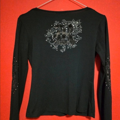Black top with prints and rhinestones like new