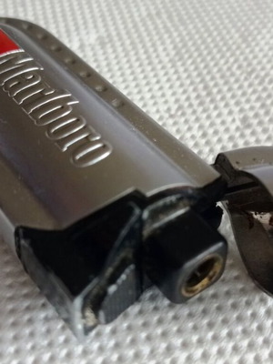 Marlboro metal lighter used, collectible with flip-top