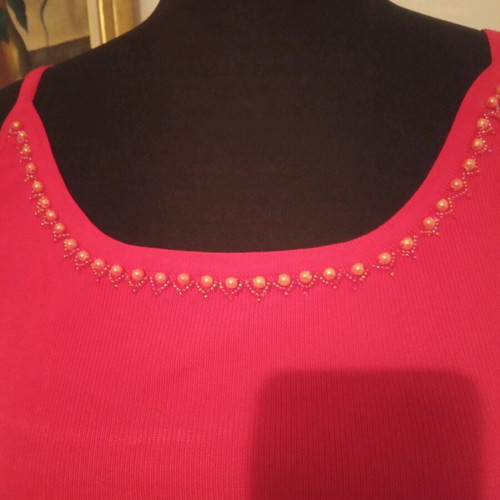 Red top size M like new decorated with pearls and beads