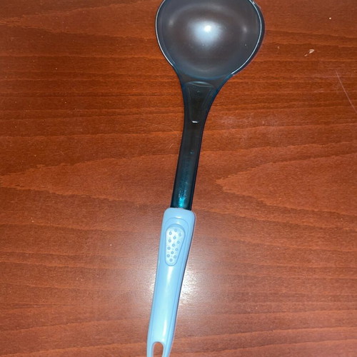 Blue serving ladle with ergonomic handle