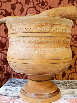 Large old wooden mortar used with pestle