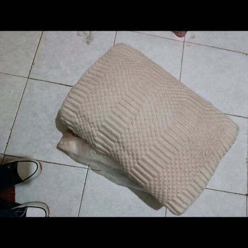 Large handmade beige pillow like new with embossed knitted decoration