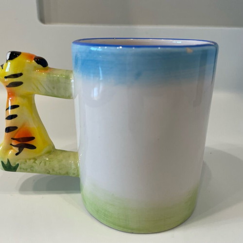 Tiger design mug used, small rim damages