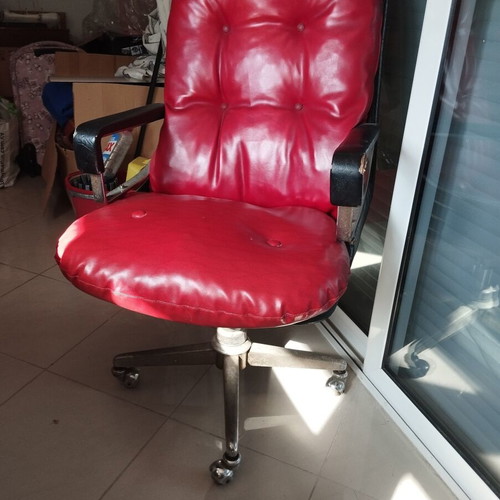 Office chair with genuine leather red used, armrest wear