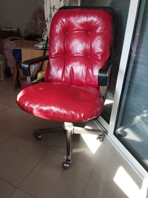 Office chair with genuine leather red used, armrest wear
