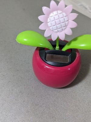 Decorative plastic flower used that moves with light