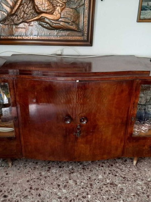 Antique buffet used with two-door cabinet and display vitrines