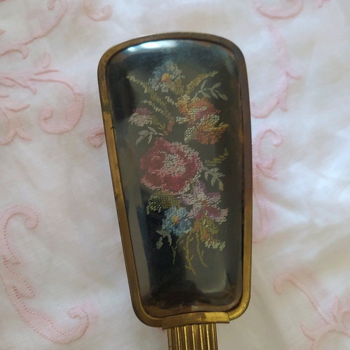 Old metal brush with embroidery used