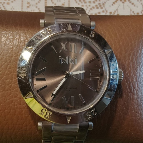 IKI Men's Quartz Watch with Brown Dial and Roman Numerals