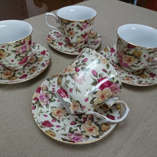 Tea and Coffee Cup Set like new, porcelain with floral pattern