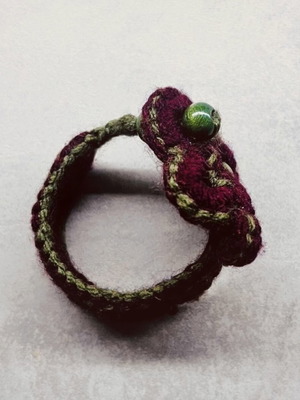 Handmade knitted bracelet with flower