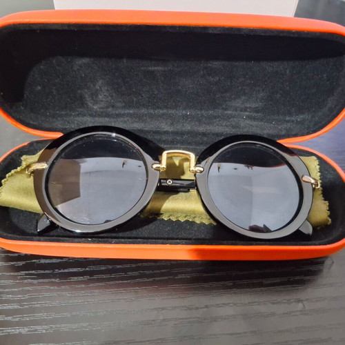 Women's sunglasses used with case and cleaning cloth, black and gold