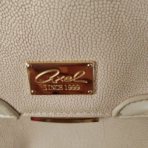 Axel pink shoulder bag used with gold details