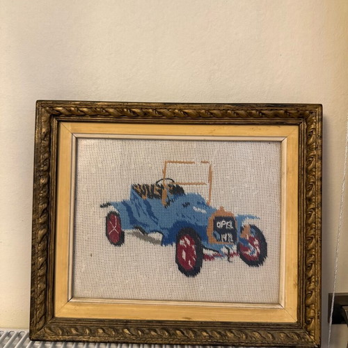 Vintage wooden frames used with hand-stitched car designs