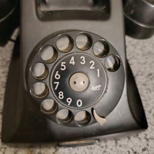 Vintage telephone used, black bakelite with rotary dial