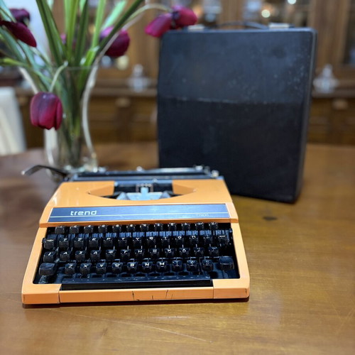 Vintage Trend Typewriter used with ribbon and case, orange color