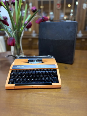 Vintage Trend Typewriter used with ribbon and case, orange color
