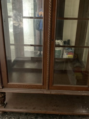 Antique handmade wood display cabinet with glass doors used