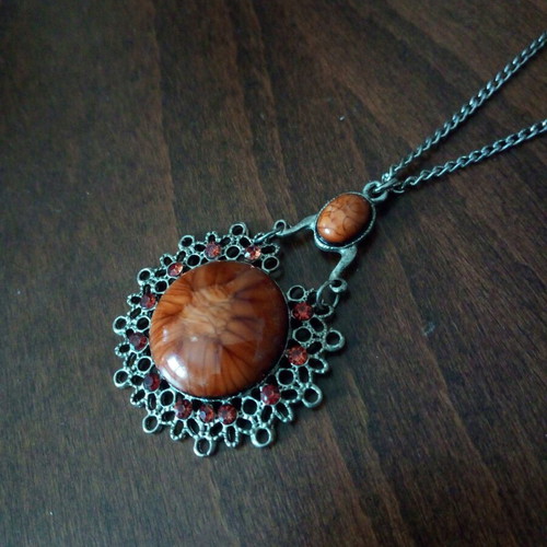 Pendant with glass light brown cabochon used, fashion jewelry