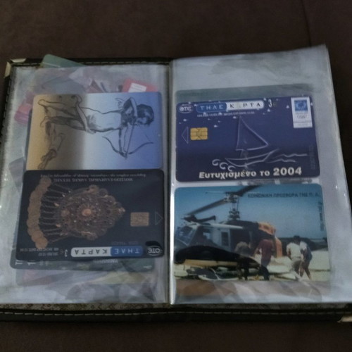 Collectible old phone cards used with album