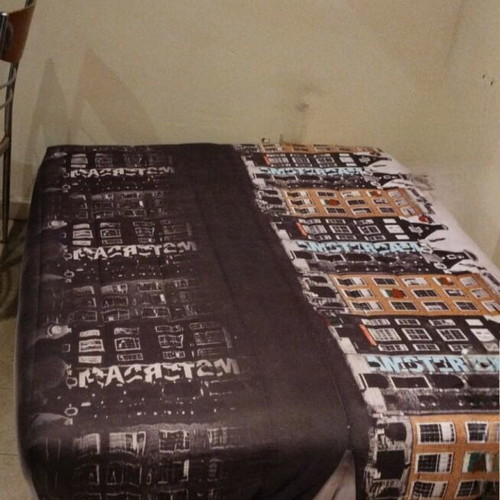 Sofa bed used, three-seater black with Amsterdam cover and storage