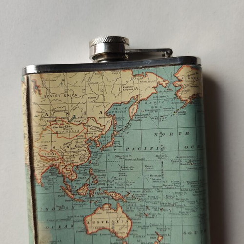 Vintage metal flask "Adventure Is Out There" with world map design