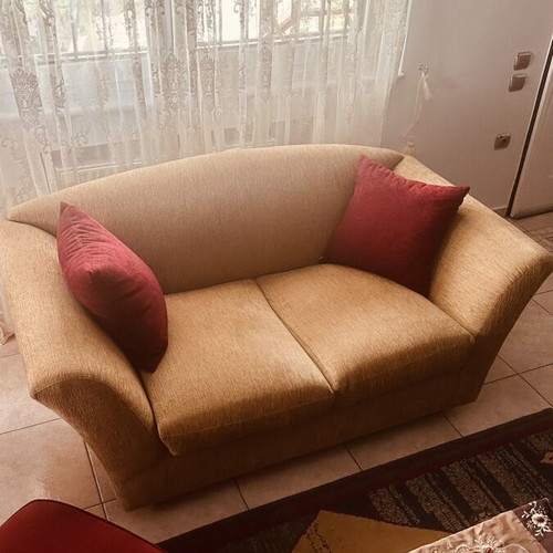 Two-seater sofa like new with elegant design and beige upholstery