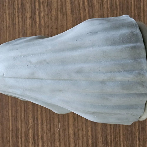 Decorative girl figurine used holding flower