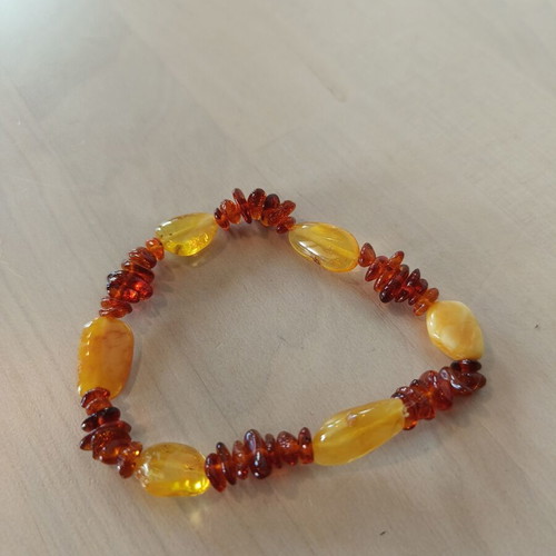 Amber bracelet like new with elastic, brown and orange
