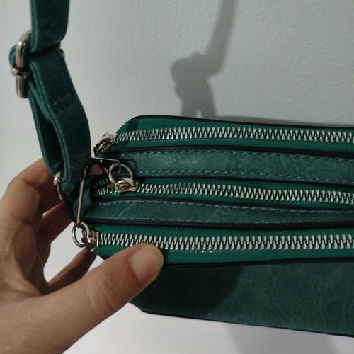 Turquoise shoulder bag with three compartments used