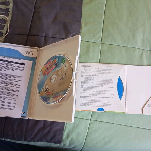 Nintendo Wii black used with Wii Motion Plus controller, nunchuk and 2 games
