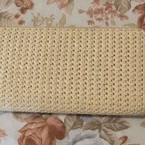 Pink straw wallet used with multiple card slots