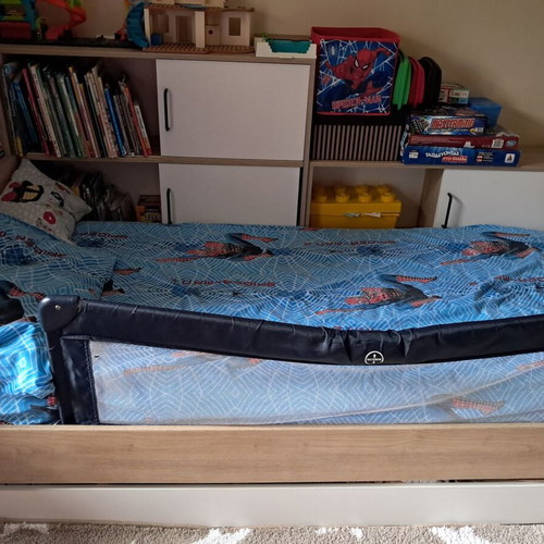 Children's bed used with bookshelf and storage drawer