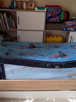 Children's bed used with bookshelf and storage drawer