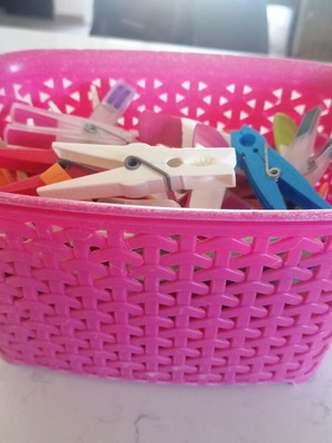 Basket with clothespins like new