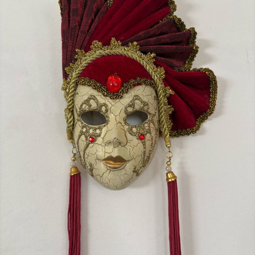 Decorative mask with red velvet details and gold embellishments, like new