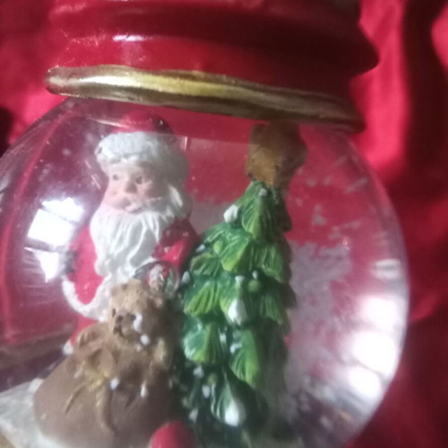 Christmas souvenir like new with Santa Claus and falling snow