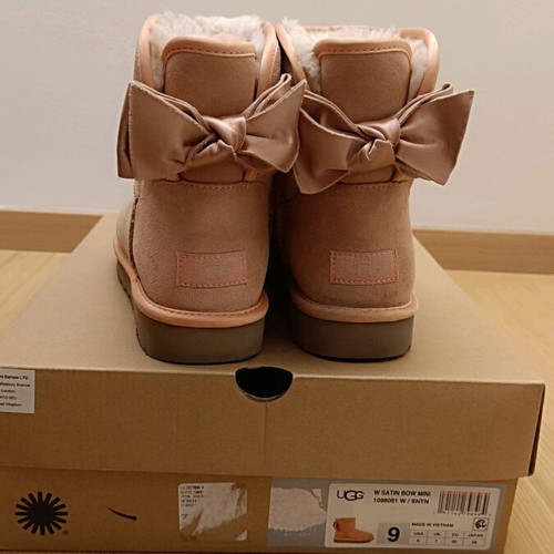 UGG pink boots with satin bow, like new