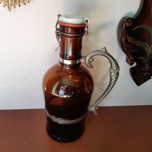 German vintage beer bottle growler with metal handle