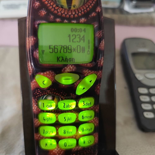 Nokia 3210 vintage cell phone used with new battery and front cover
